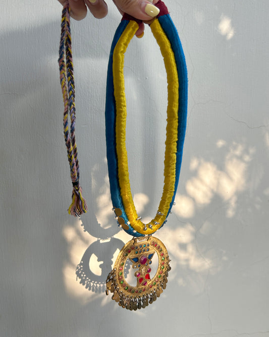 Afghan statement round necklace - Blue yellow cord