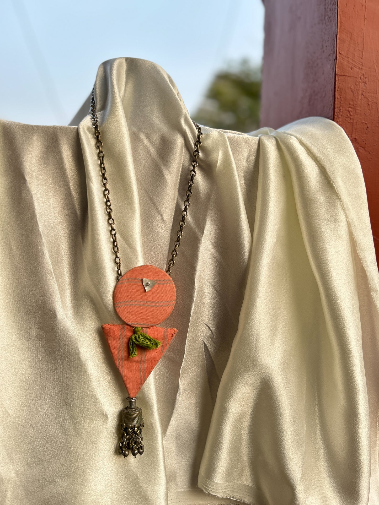 Aakar orange green tassle necklace