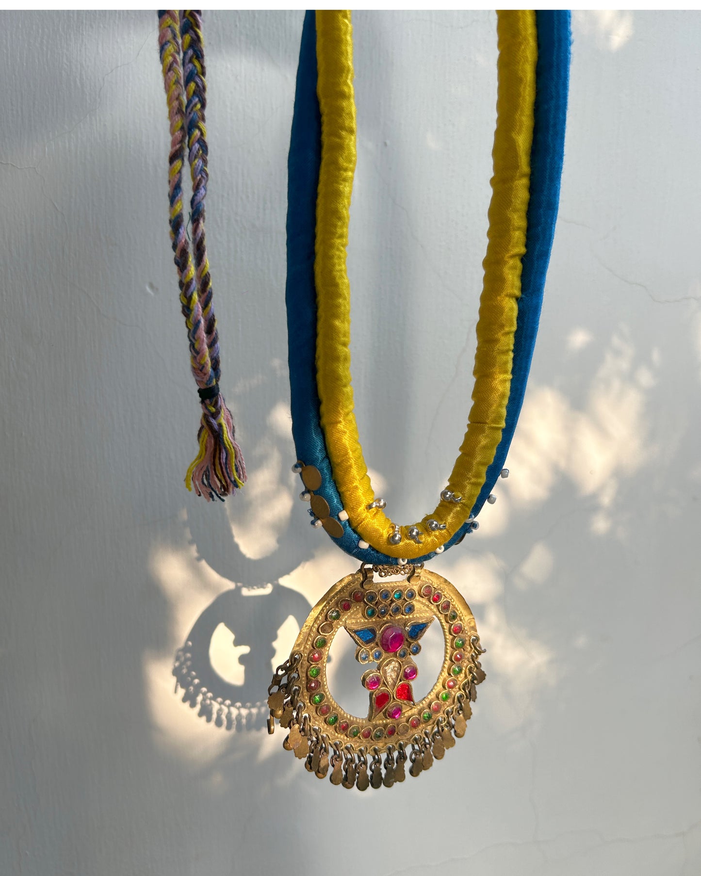 Afghan statement round necklace - Blue yellow cord