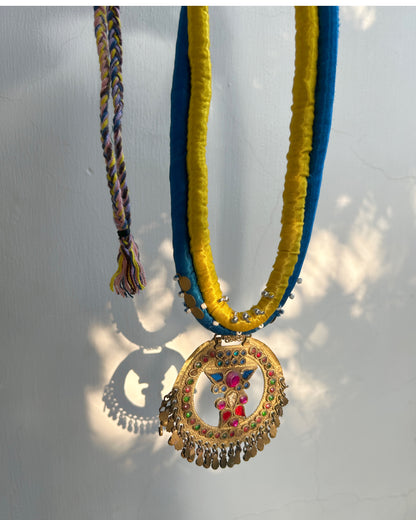 Afghan statement round necklace - Blue yellow cord